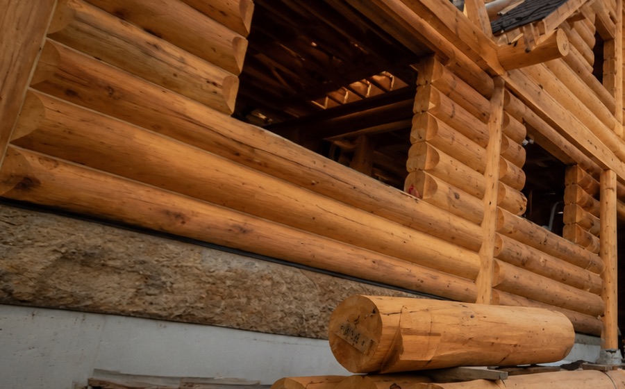 Timber frame home under construction on a clear day in British Columbia